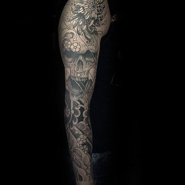 Man With Chrysanthemum Themed Skull And Flowers Sleeve Tattoos