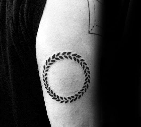 Man With Circle Olive Branch Arm Tattoo