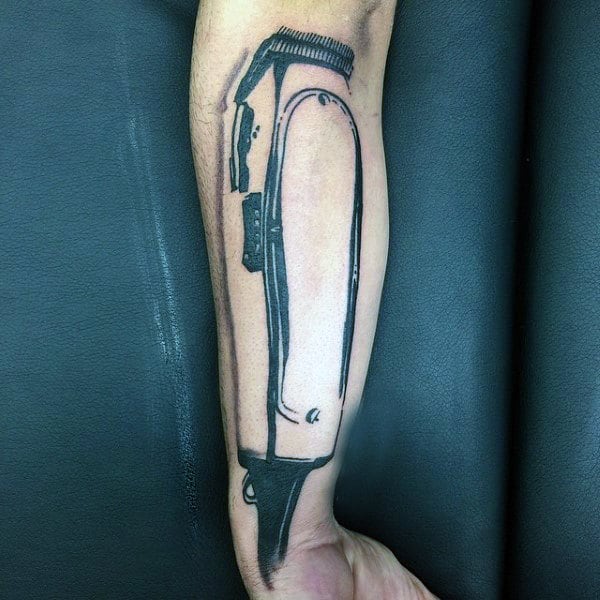 Man With Clipper Barber Tattoo On Inner Forearm.