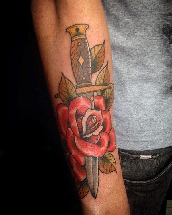 Man With Cool Dagger Red Rose Traditional Dagger Outer Forearm Tattoo