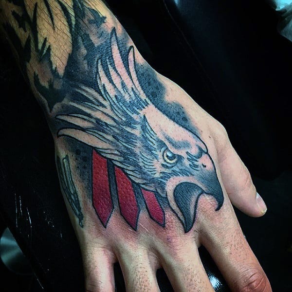 Man With Cool Dark Ink Hawk Hand Tattoo