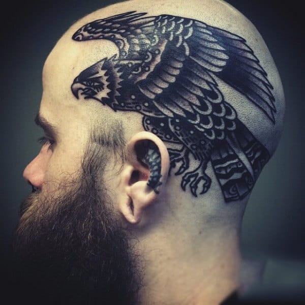 Man With Cool Hawk Head Tattoo In Black Ink