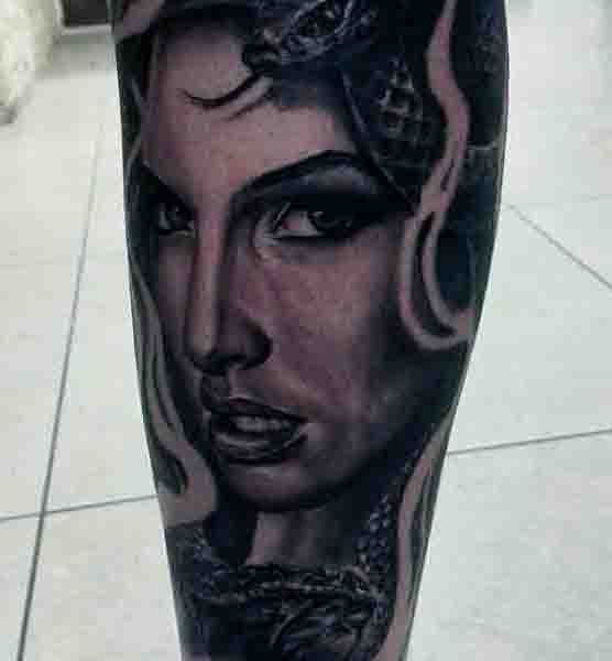 Man With Cool Medusa Tattoo On Legs
