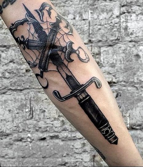 Man With Cool Sword Tattoo Around Elbow