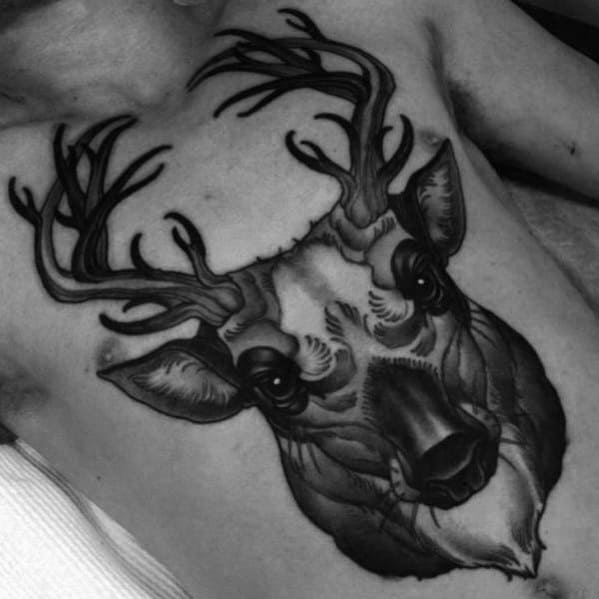 Man With Cool Tattoo Of Traditional Deer On Chest