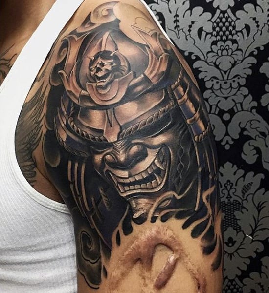 Man With Dark Shaded Samurai Mask Shoulder Tattoo