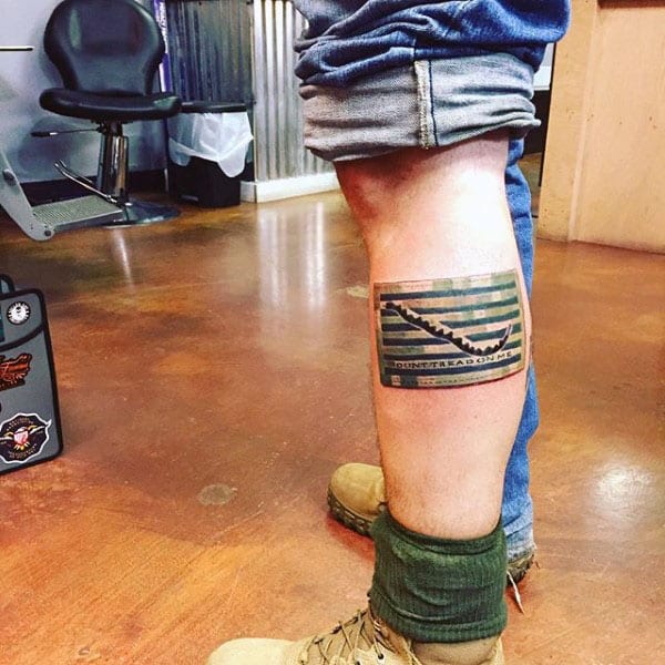 Man With Dont Tread On Me Flag Camouflage Tattoo On Leg Calf