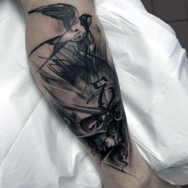 Man With Eerie Skull And Sparrow Tattoo Calves