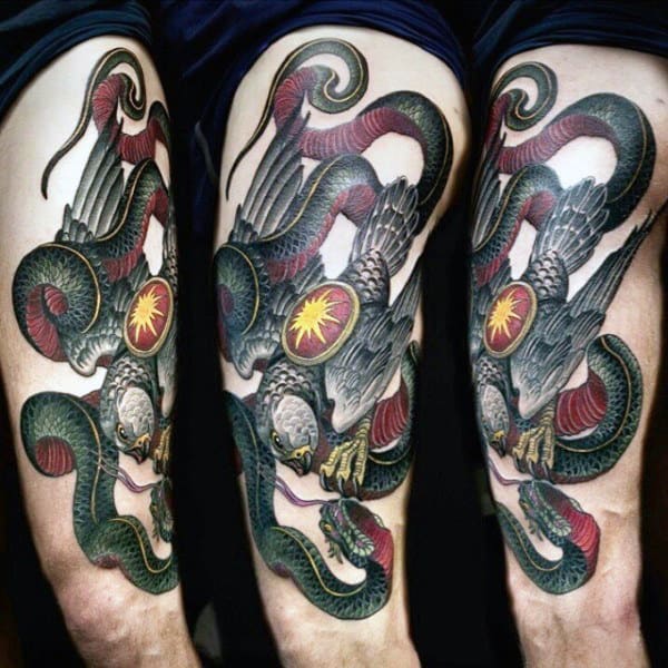 Man With Falcon Snake Thigh Tattoo