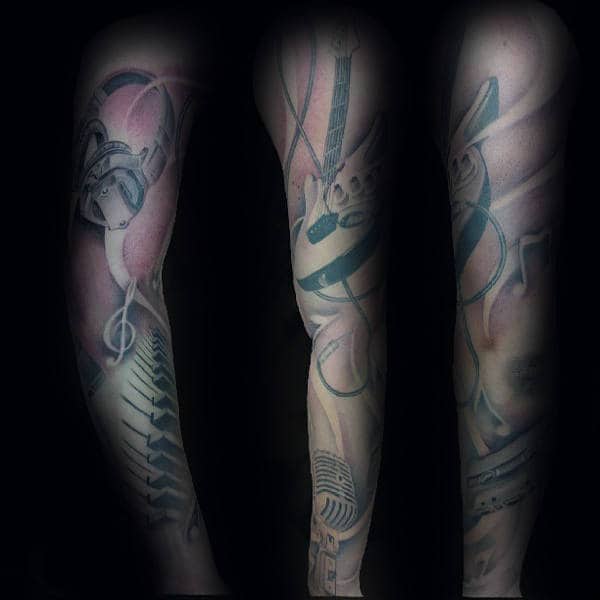 Man With Full Arm Music Sleeve Tattoo Design