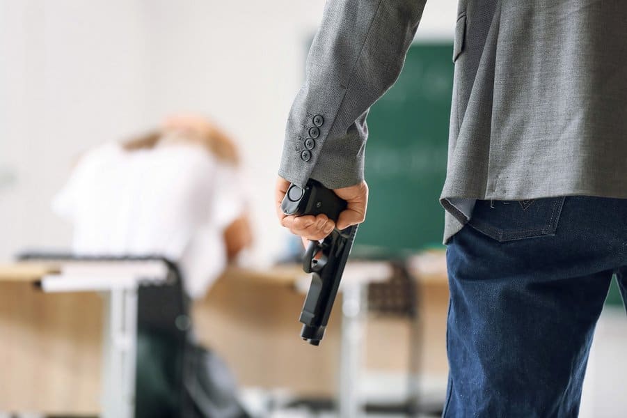 man with gun in classroom