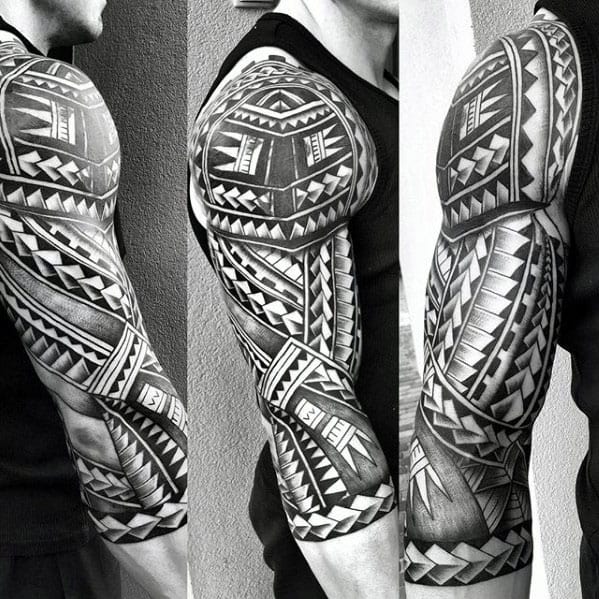 Man With Half Sleeve Tattoo With Polynesian Tribal Design