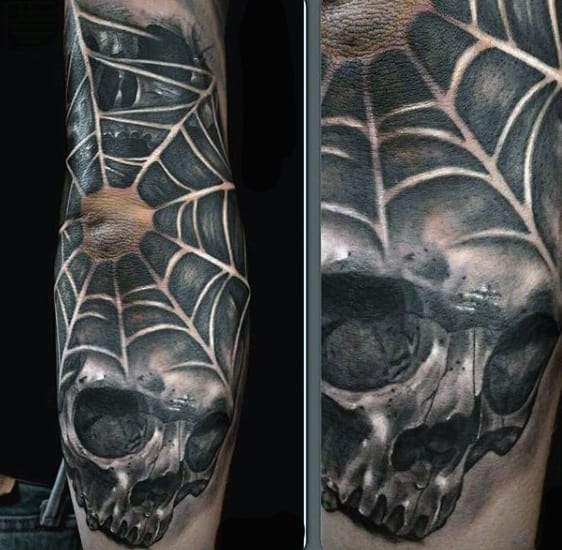 Man With Haunting Skull And Spider Web Tattoo On Arms