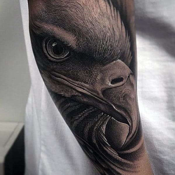 Man With Hyper Realistic Eagle Head Tattoo On Outer Forearm