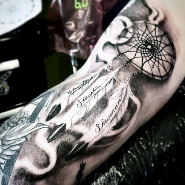 Man With Incredible Shaded Ink Dreamcatcher Bicep And Arm Tattoo