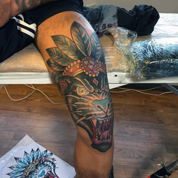 Man With Indian Black Jaguar Knee Tattoo