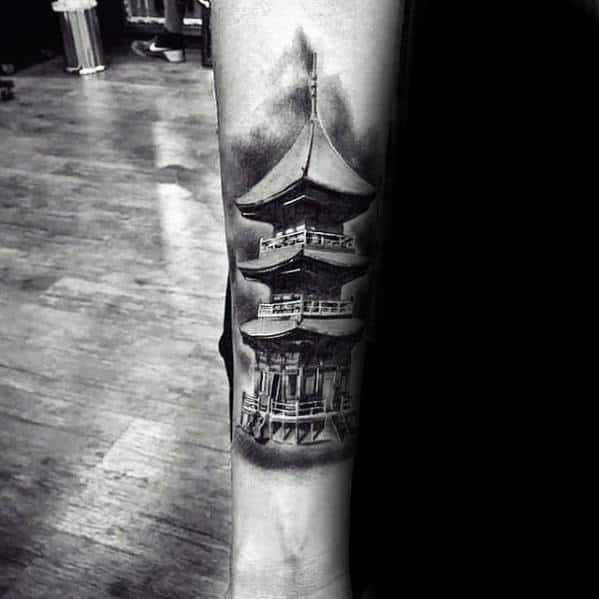Man With Inner Forearm Tattoo Of Japanese Temple