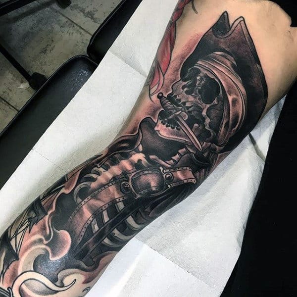 Man With Interesting Tattoo Of Skeleton With Knife In The Mouth Tattoo