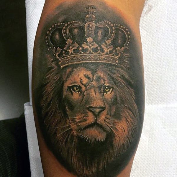 Man With Leg Calf Tattoo Design Of Lion With Crown
