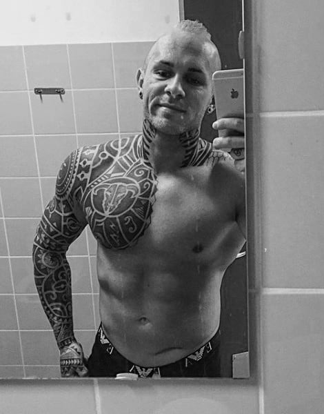Man With Maori Sleeve And Shoulder Tattoo
