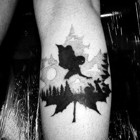 Man With Maple Leaf Hawk Tattoo On Leg Calf