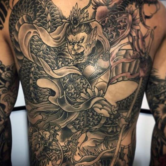 Man With Monkey King Tattoo Design On Back Of Body