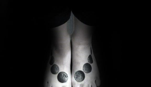 Man With Moon Phases Tattoos On Both Feet