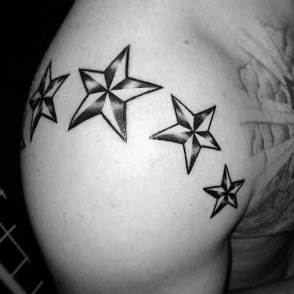 Man With Nautical Stars Tattoos Around Shoulder