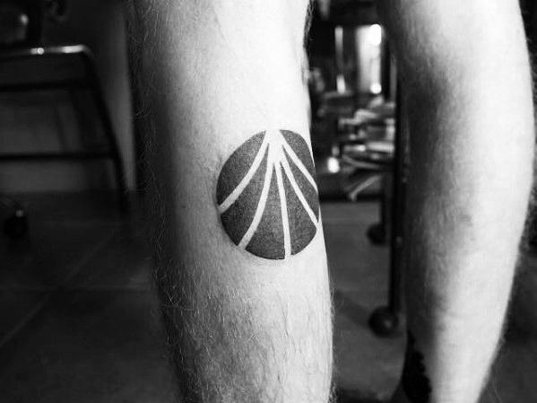 Man With Negative Space Circle Pattern Simple Leg Tattoo