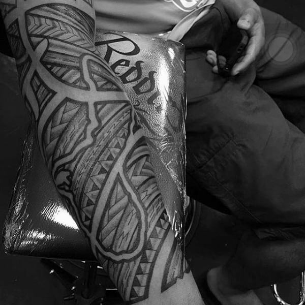 Man With Negative Space Tribal Polynesian Forearm Sleeve Tattoo