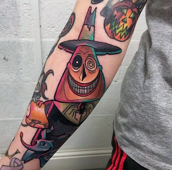 Man With Night Before Christmas Tattoo Of The Maoy Of Halloween Town On Forearm