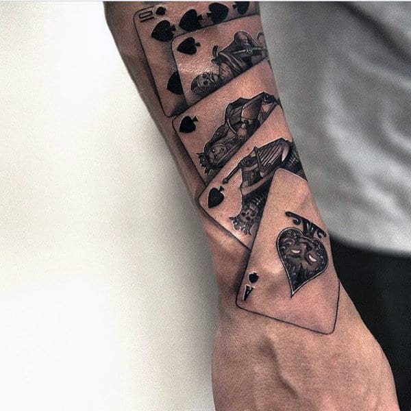 Man With Original Playing Cards Forearm Tattoo