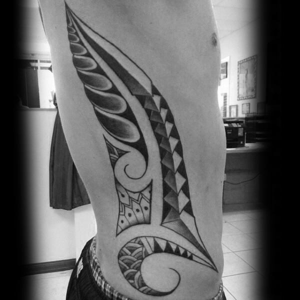 Man With Polynesian Tribal Rib Tattoo