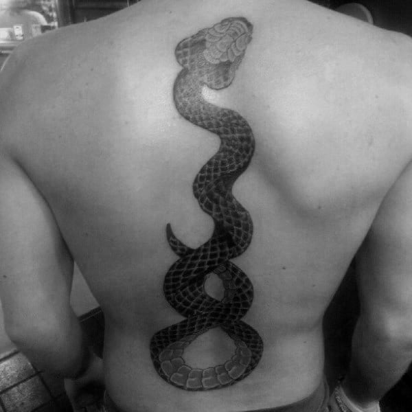Man With Rattlesnake Spine Tattoo On Back