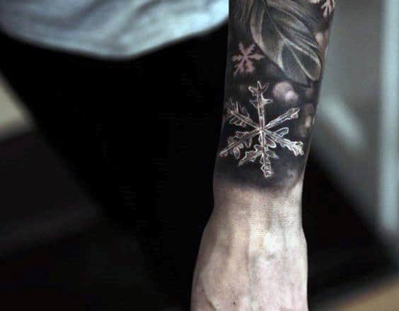 Man With Realistic Snowflake Tattoo Ice Crystal On Wrist