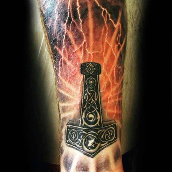 Man With Realistic Thor Hammer Tattoo On Forearm