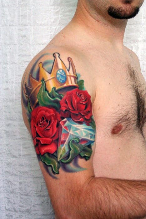 Man With Red Roses And Diamond Crown Tattoo On Biceps