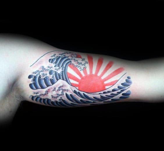 Man With Rising Sun Waves Bicep Tattoo