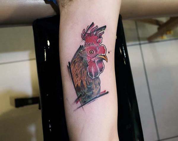 Man With Rooster Tattoo On Forearm In Simplistic Style