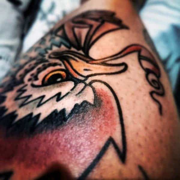 Man With Rooster Tattoo On Forearm With Strong Linework