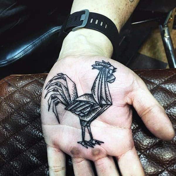 Man With Rooster Tattoo On Palm Of His Hand In Black Work