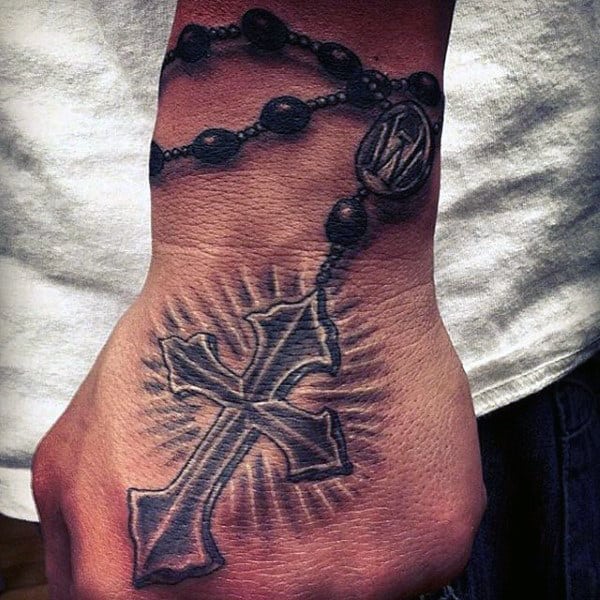 Man With Rosary Tattoo On Hand
