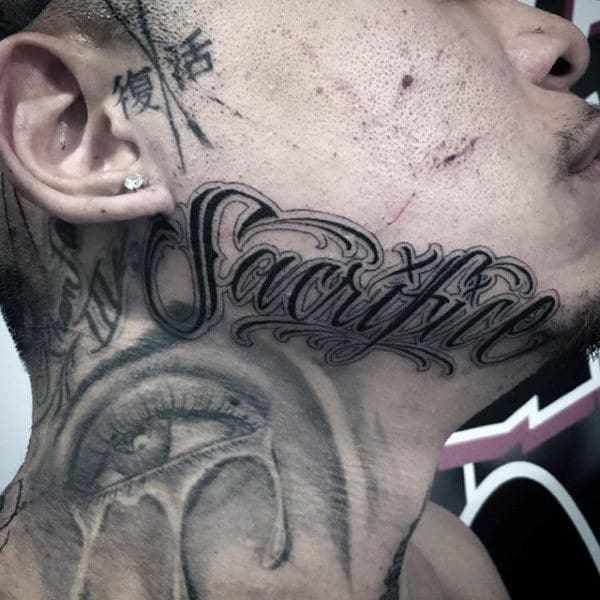 Man With Sacrifice Word Tattoo On Face