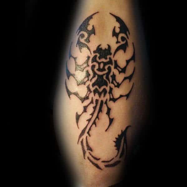 Man With Scorpion Tribal Outer Forearm Tattoo