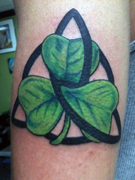 Man With Shamrock Celtic Tattoo On Arm