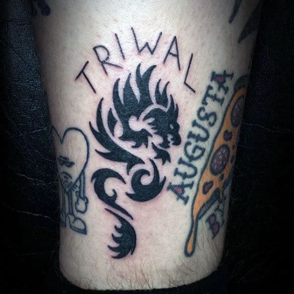Man With Small Simple Tribal Dragon Tattoo Design