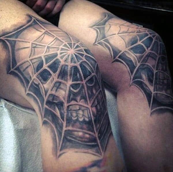 Man With Spider Web Tattoo On Knees