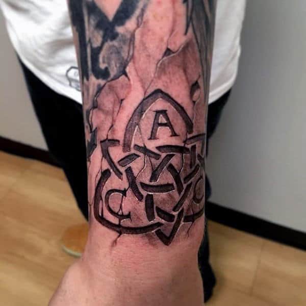 Man With Stone Celtic Knot 3d Tattoo On Wrist