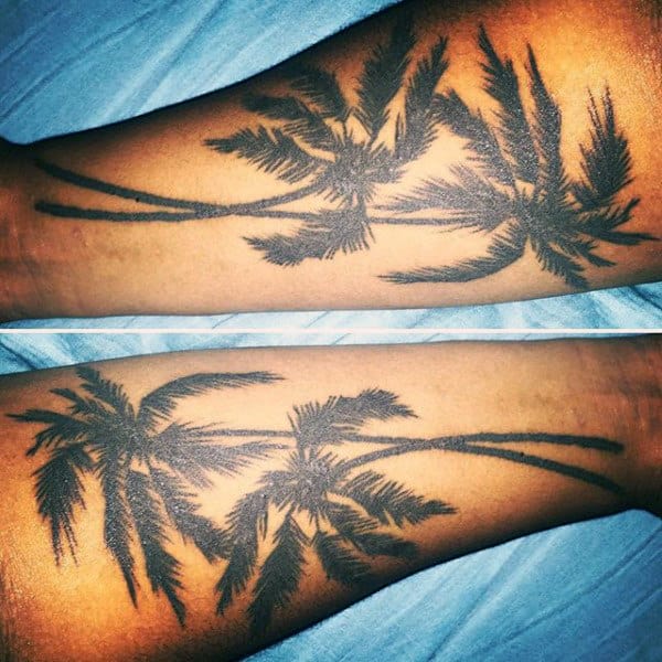 Man With Stunning Palm Tree Tattoo On Both Inner Arms