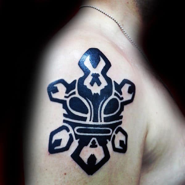 Man With Taino Upper Arm Sun Tattoo Black Ink Design